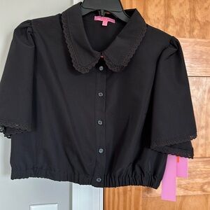 Ladies crop button up with collar and elastic waist band at bottom.